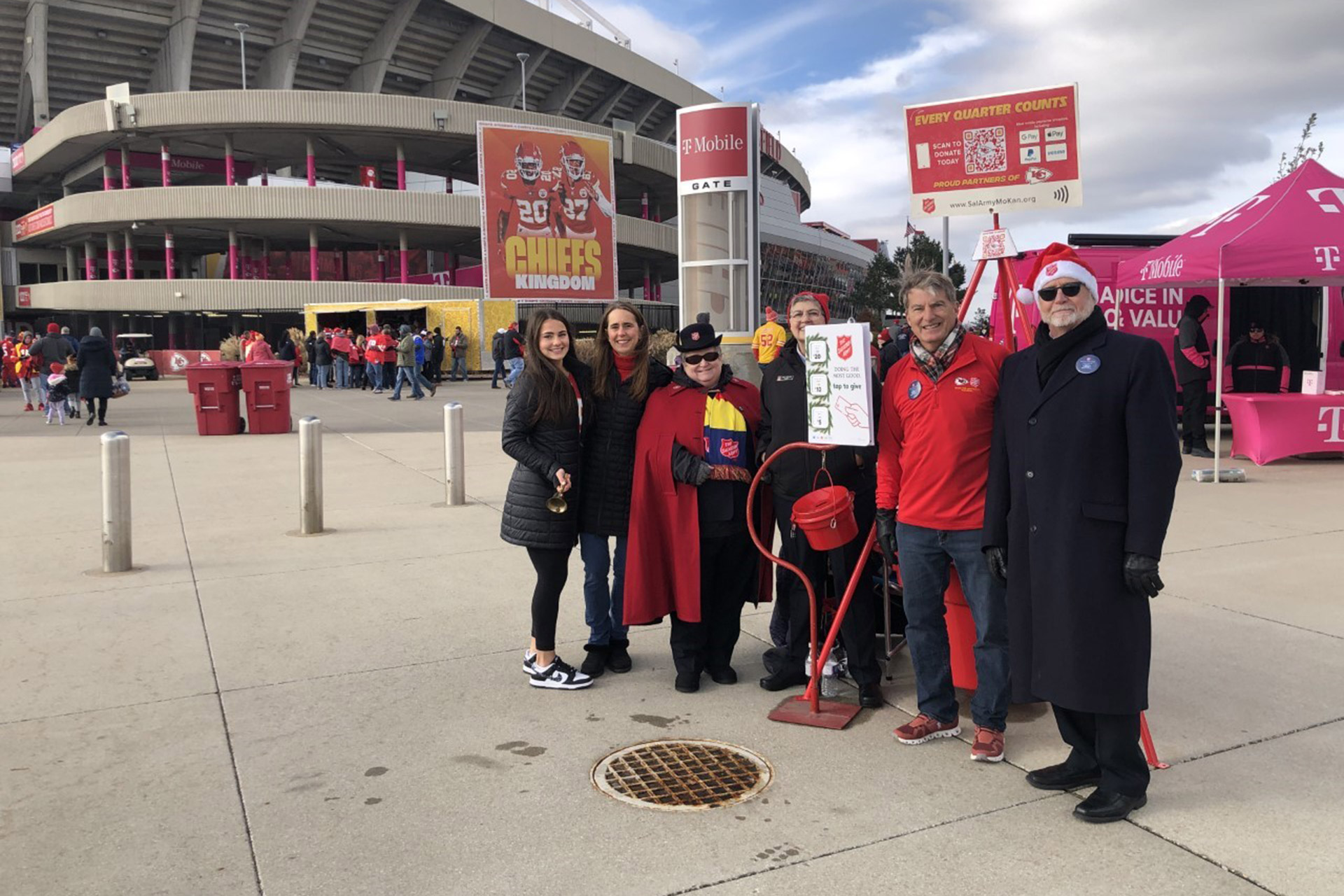 Family in front of Kansas City Chiefs stadium